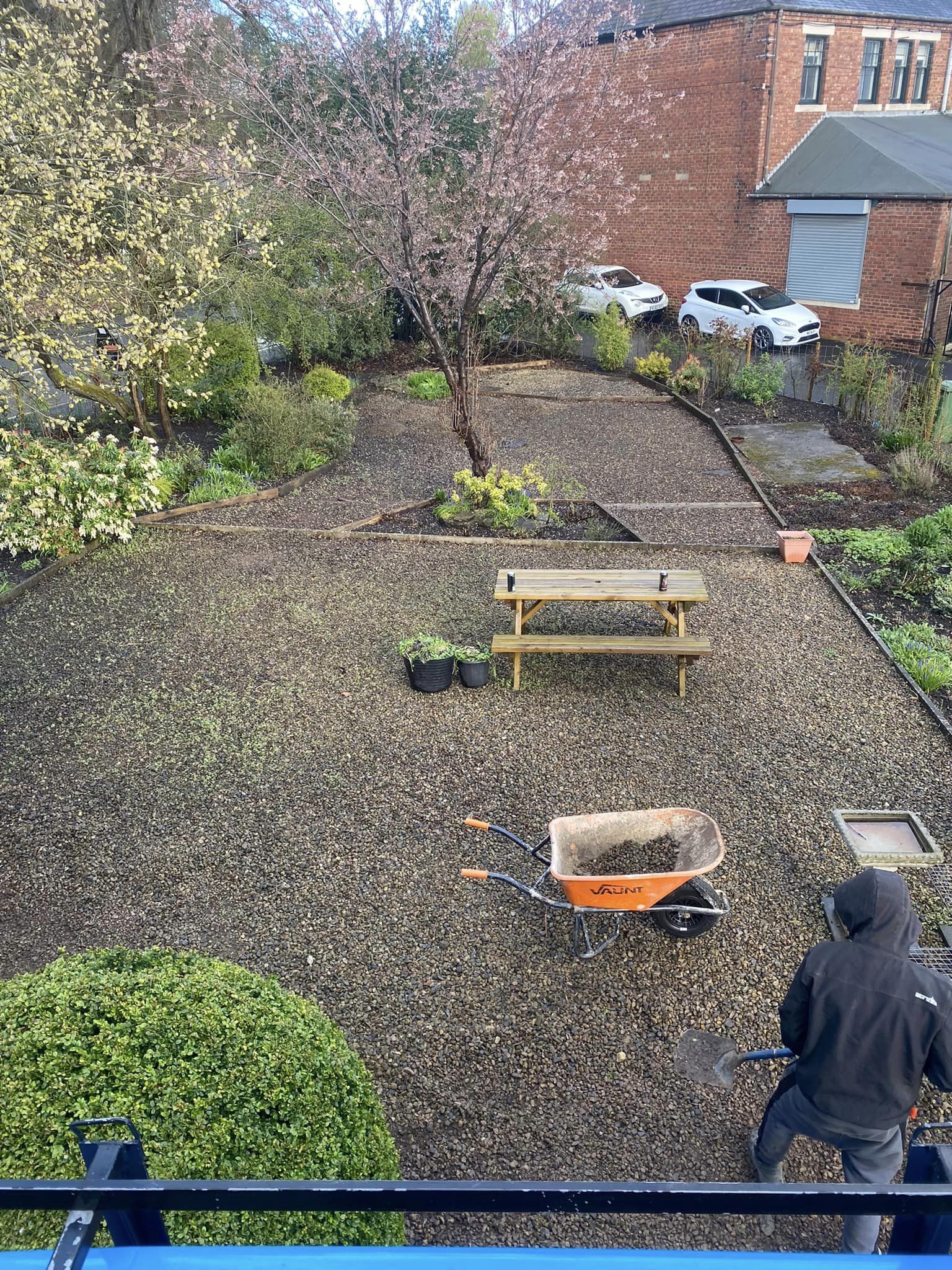 A large porcelain patio in front of a modern brick house